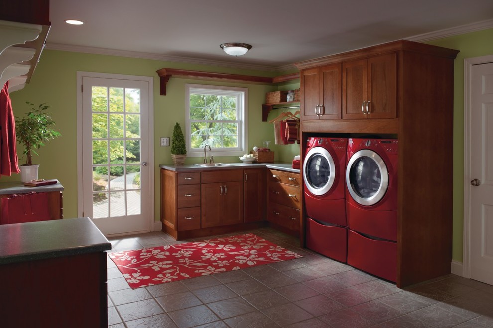 Design ideas for a large classic u-shaped utility room in Other with shaker cabinets, medium wood cabinets, green walls, ceramic flooring and a side by side washer and dryer.