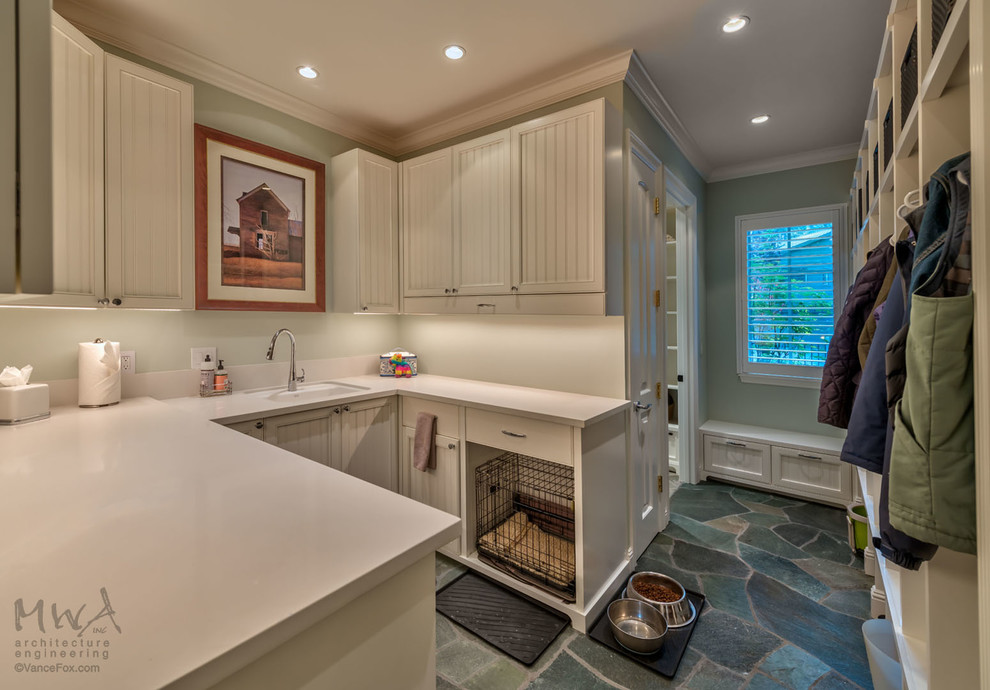 Example of a large transitional u-shaped slate floor and multicolored floor utility room design in Other with an undermount sink, beaded inset cabinets, white cabinets, quartz countertops, green walls and beige countertops