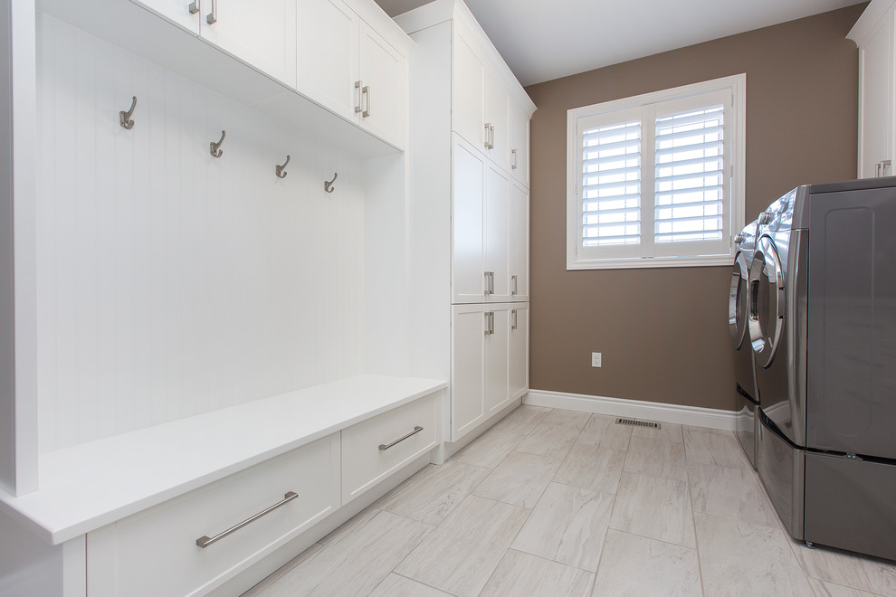 Mid-sized transitional galley ceramic tile dedicated laundry room photo in Toronto with an undermount sink, shaker cabinets, white cabinets, beige walls and a side-by-side washer/dryer