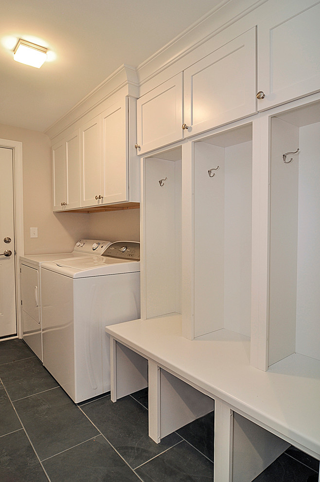 Design ideas for a medium sized classic utility room in Nashville with shaker cabinets, white cabinets, wood worktops, porcelain flooring and a side by side washer and dryer.
