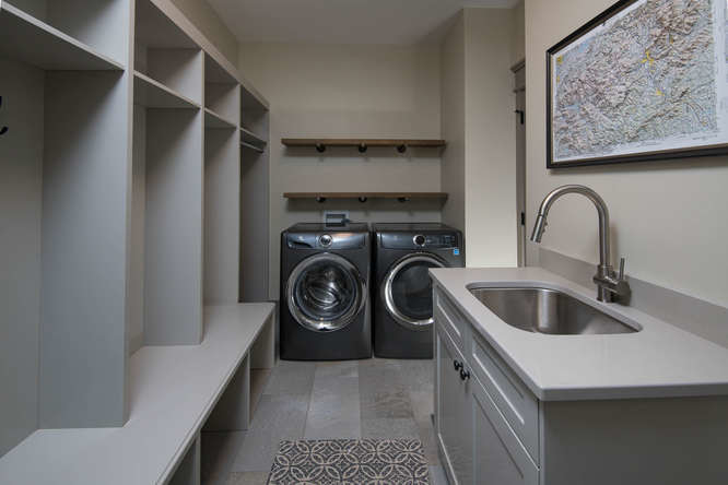Design ideas for a medium sized classic u-shaped utility room in Other with a submerged sink, shaker cabinets, grey cabinets, composite countertops, grey walls, a side by side washer and dryer and grey floors.