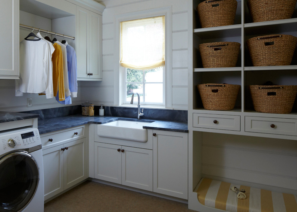 Inspiration for a timeless l-shaped laundry room remodel in Atlanta with a farmhouse sink and a side-by-side washer/dryer