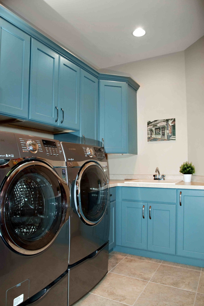 Example of a transitional laundry room design in Other