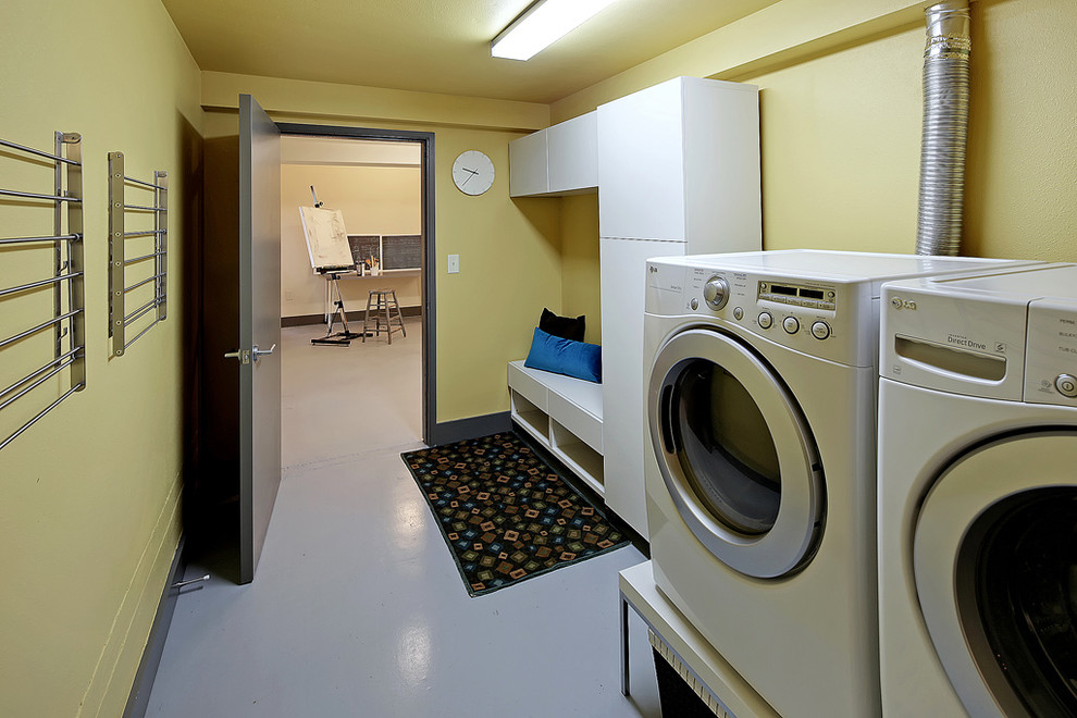 Example of a mid-century modern laundry room design in Seattle
