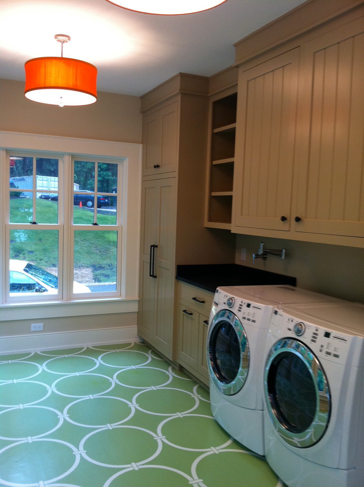 Example of a large trendy galley dedicated laundry room design in Milwaukee with shaker cabinets and a side-by-side washer/dryer