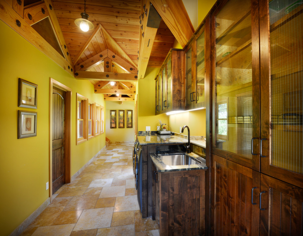 Esempio di una lavanderia american style con lavello sottopiano, ante in stile shaker, ante in legno bruno, pareti verdi, pavimento beige, top grigio, soffitto a volta e soffitto in legno