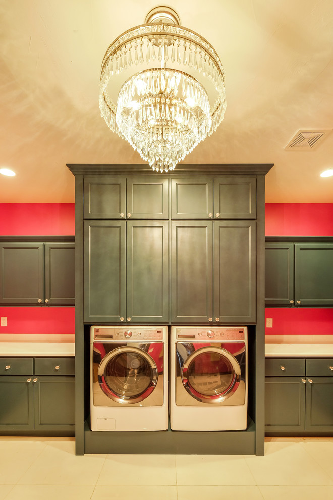 Example of a huge ornate u-shaped dedicated laundry room design in Denver with a side-by-side washer/dryer