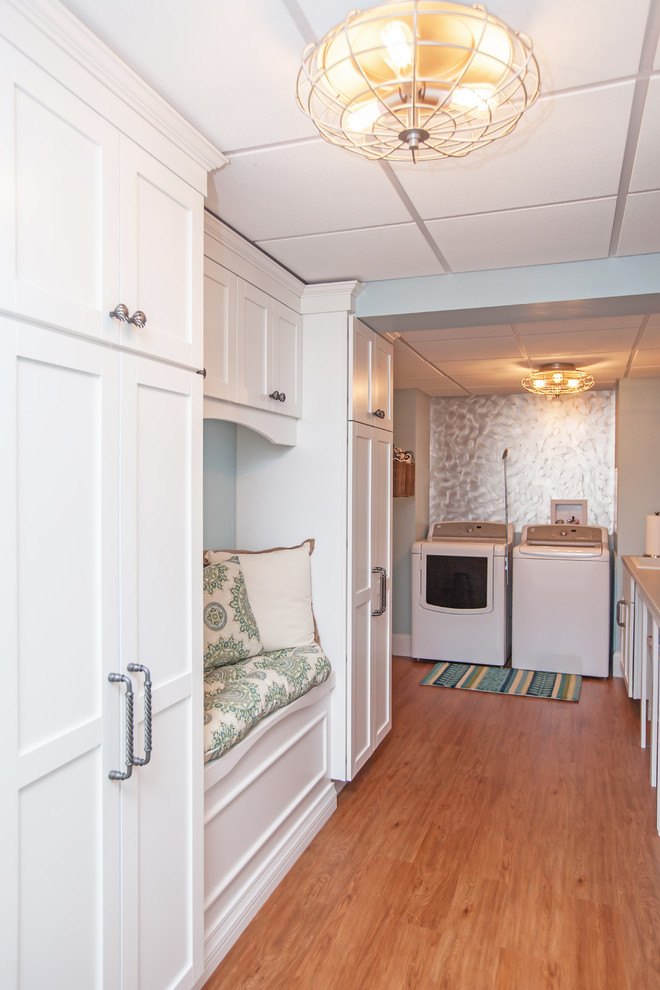 Medium sized coastal galley separated utility room in Boston with a single-bowl sink, shaker cabinets, white cabinets, laminate countertops, blue walls, lino flooring and a side by side washer and dryer.