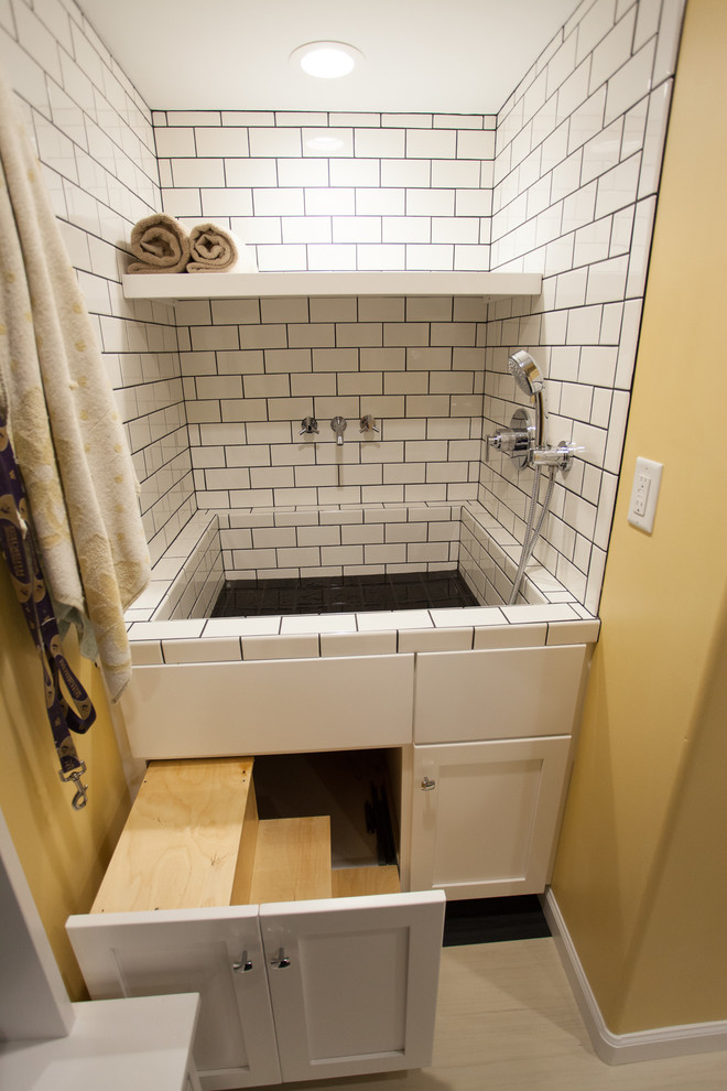 Photo of a large traditional utility room in Seattle with an integrated sink, shaker cabinets, white cabinets, laminate countertops, yellow walls, lino flooring and a side by side washer and dryer.