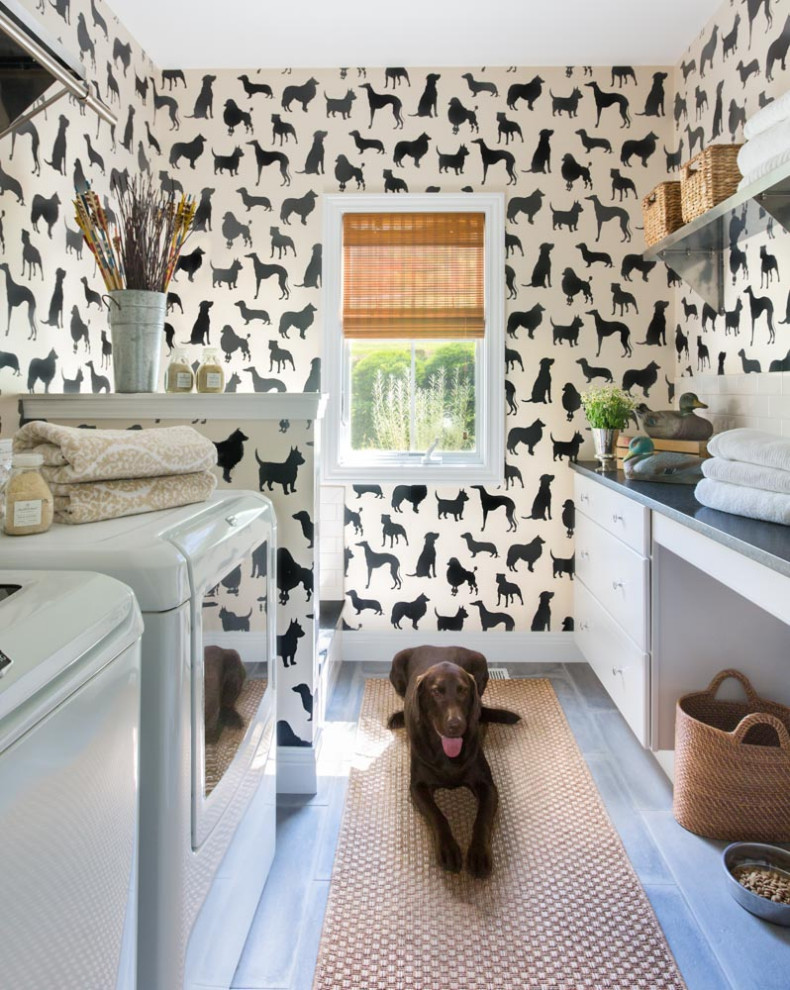 Traditional galley separated utility room in St Louis with flat-panel cabinets, white cabinets, engineered stone countertops, multi-coloured walls, porcelain flooring, a side by side washer and dryer and grey worktops.