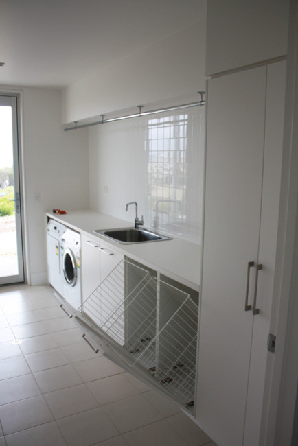 Photo of a medium sized contemporary single-wall utility room in Adelaide.
