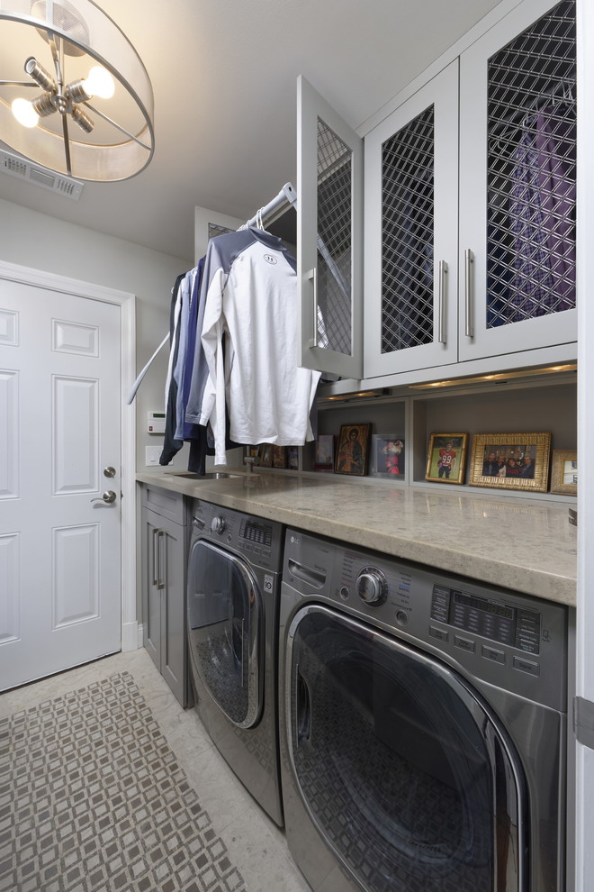 Design ideas for a medium sized traditional galley utility room in DC Metro with a submerged sink, shaker cabinets, grey cabinets, limestone worktops, grey walls, marble flooring, a side by side washer and dryer, grey floors and grey worktops.