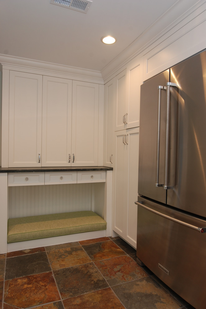 Example of a large transitional slate floor and multicolored floor dedicated laundry room design in Chicago with an undermount sink, recessed-panel cabinets, white cabinets, granite countertops, white walls, a side-by-side washer/dryer and gray countertops