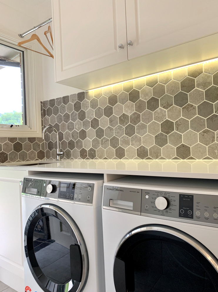 Example of a trendy laundry room design in Sydney