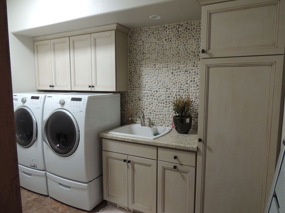 Photo of a medium sized classic single-wall separated utility room in Other with a built-in sink, recessed-panel cabinets, light wood cabinets, laminate countertops, white walls, lino flooring, a side by side washer and dryer and beige floors.