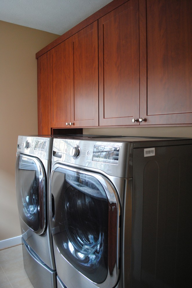 Elegant laundry room photo in DC Metro with shaker cabinets and a side-by-side washer/dryer