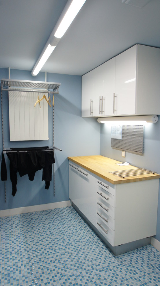 Laundry room - contemporary laundry room idea in Other