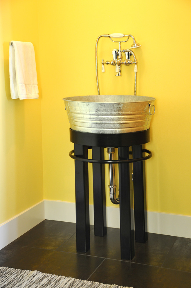 Design ideas for a modern utility room in Other with an utility sink and yellow walls.