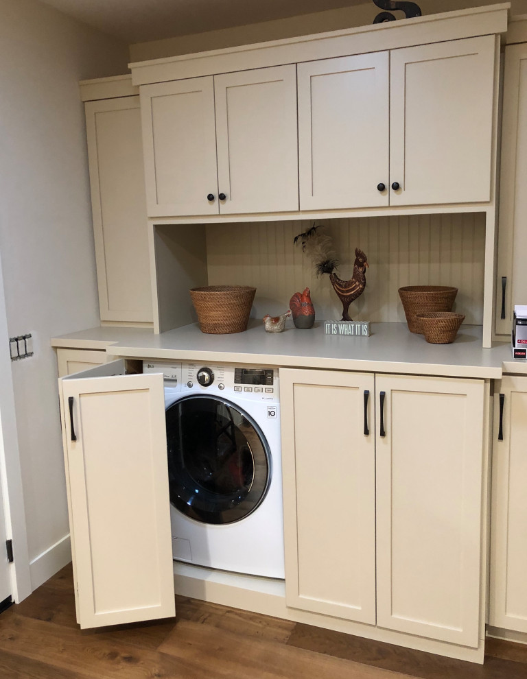 Example of a small classic single-wall utility room design in Sacramento with shaker cabinets, white cabinets, wood countertops and a side-by-side washer/dryer