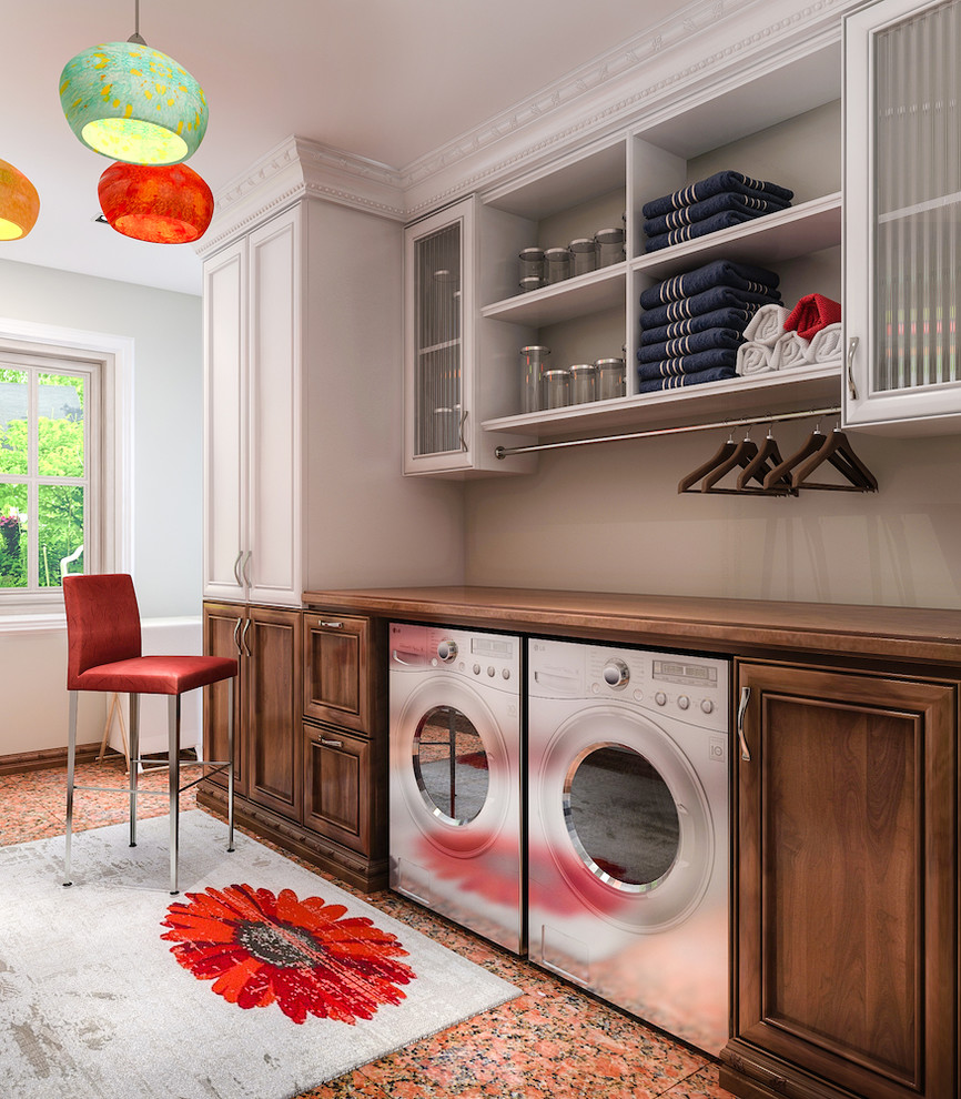 Inspiration for a medium sized traditional single-wall utility room in Los Angeles with wood worktops, lino flooring, a side by side washer and dryer, orange floors, recessed-panel cabinets, dark wood cabinets and grey walls.