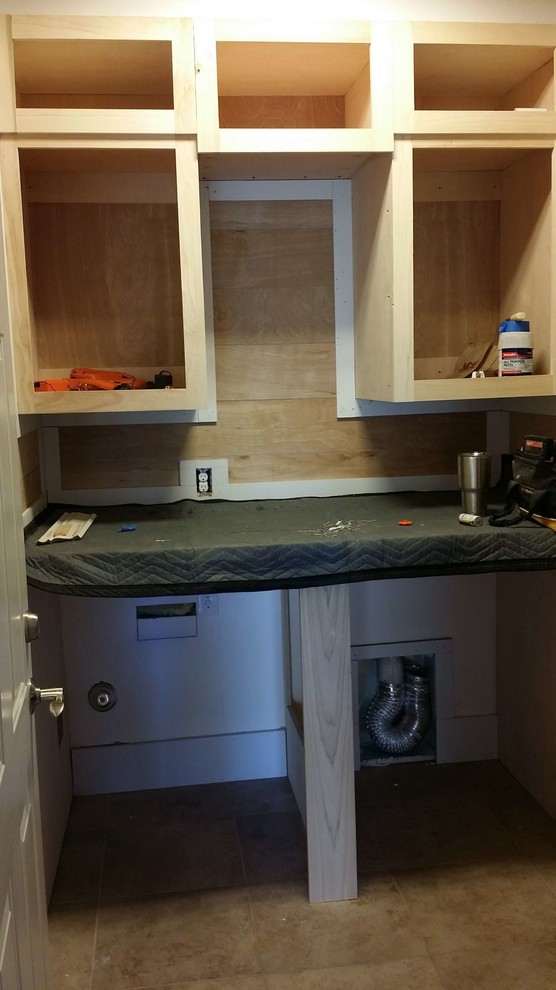 Photo of a beach style utility room in Other.