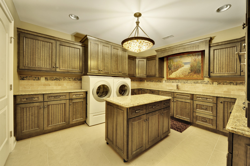 Elegant laundry room photo in Philadelphia with dark wood cabinets and a side-by-side washer/dryer