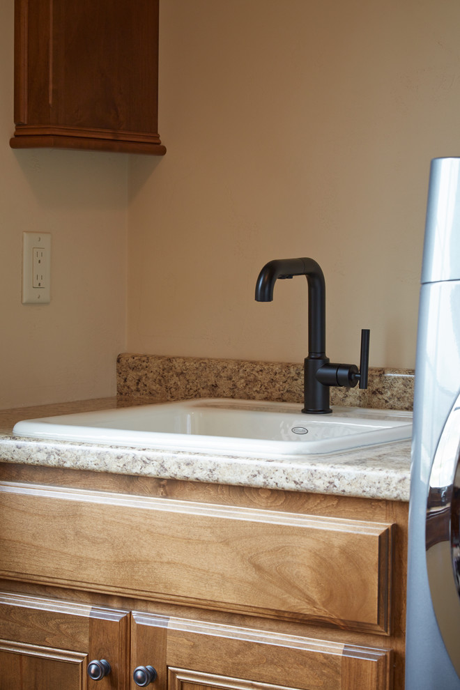 Laundry room faucet in matte black Traditional Laundry Room Other