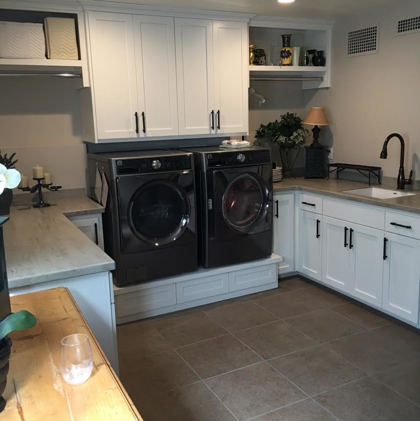 Example of a trendy laundry room design in Other with shaker cabinets, white cabinets, a side-by-side washer/dryer and an undermount sink