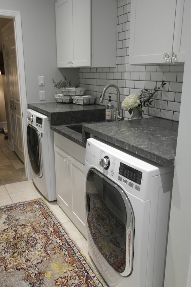 Inspiration for a small contemporary galley dedicated laundry room remodel in Toronto with an undermount sink, shaker cabinets, white cabinets, quartz countertops, green walls and a side-by-side washer/dryer