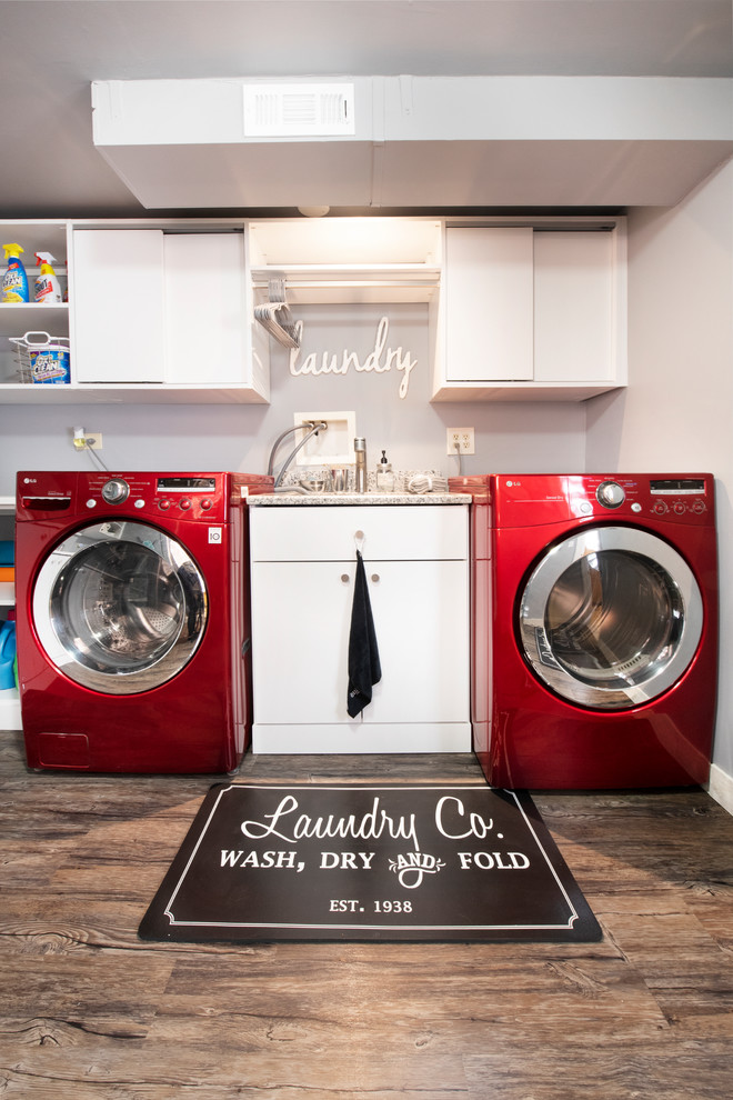 Mid-sized minimalist vinyl floor and brown floor dedicated laundry room photo in Chicago with flat-panel cabinets, white cabinets, laminate countertops, gray walls, an integrated washer/dryer and white countertops
