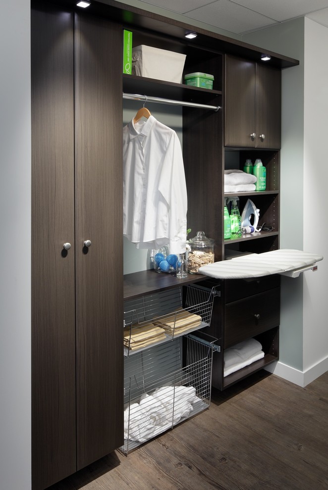 Inspiration for a medium sized contemporary galley separated utility room in Chicago with flat-panel cabinets, dark wood cabinets, wood worktops and a stacked washer and dryer.