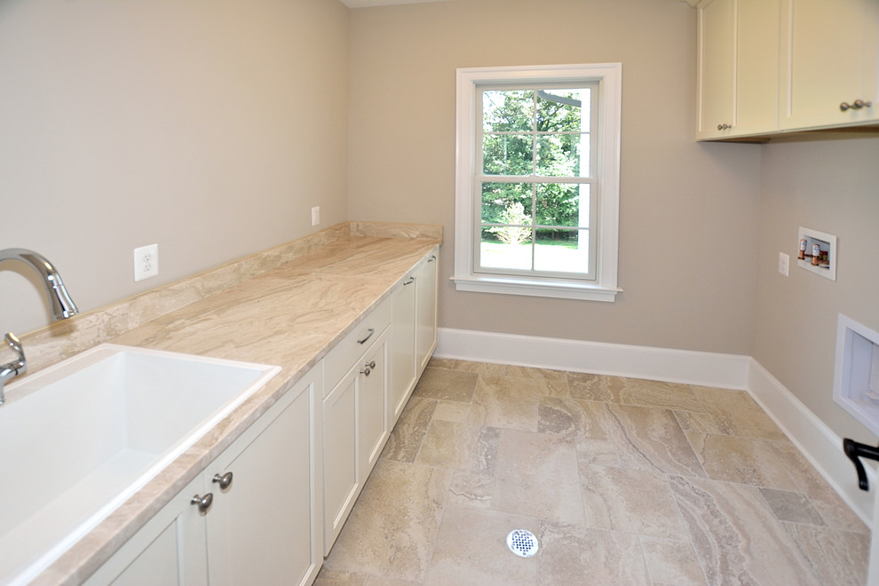 Design ideas for a medium sized traditional galley separated utility room in DC Metro with a built-in sink, recessed-panel cabinets, white cabinets, granite worktops, beige walls, ceramic flooring, a side by side washer and dryer and multi-coloured floors.