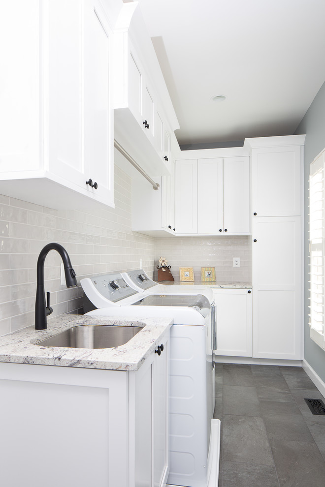Design ideas for a medium sized traditional l-shaped separated utility room in DC Metro with a submerged sink, shaker cabinets, white cabinets, granite worktops, blue walls, porcelain flooring, a side by side washer and dryer and grey floors.
