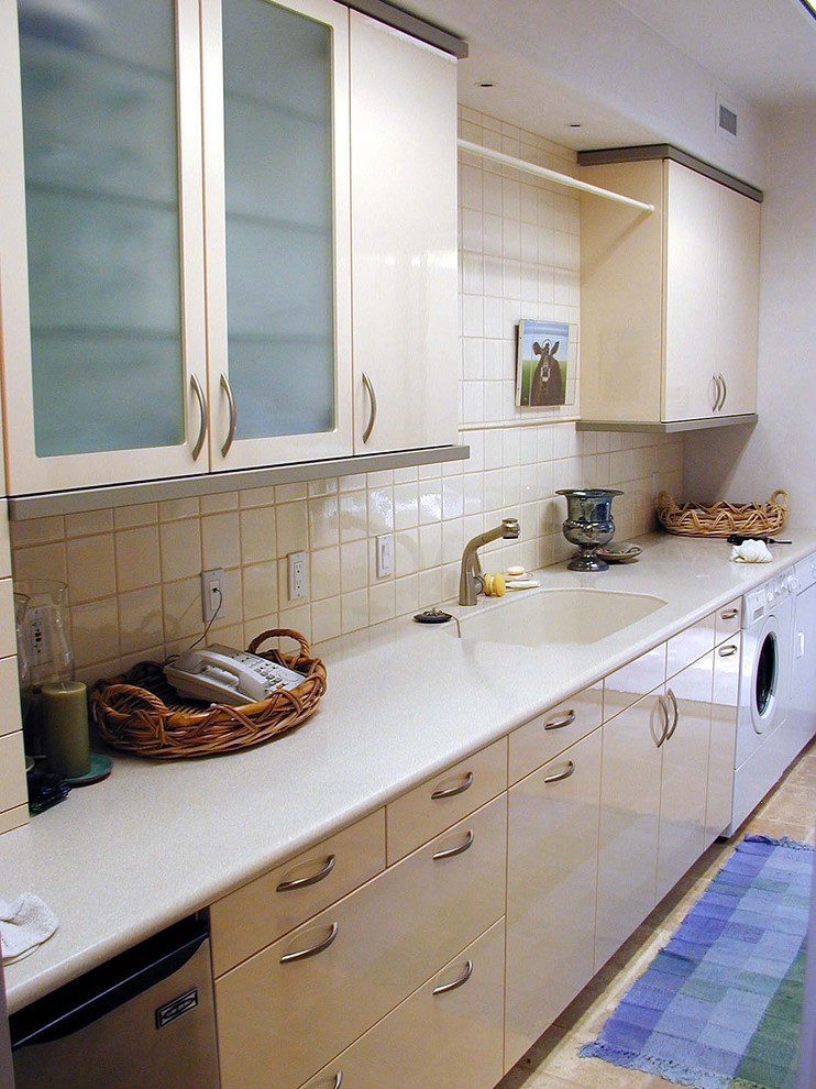 Trendy laundry room photo in Hawaii with flat-panel cabinets, beige cabinets, a side-by-side washer/dryer and beige countertops