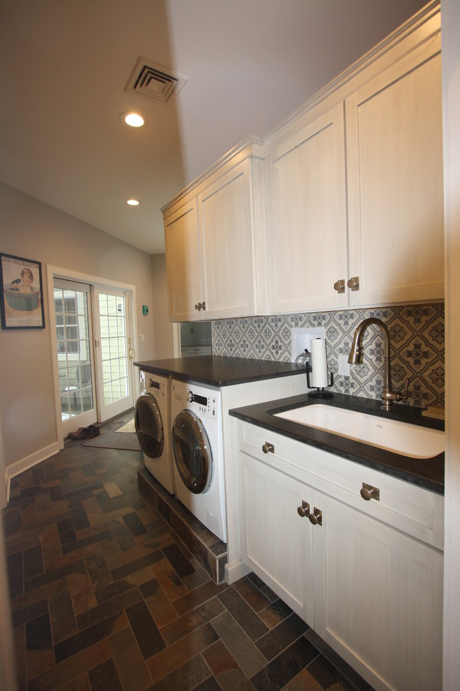 Medium sized classic separated utility room in New York with a submerged sink, recessed-panel cabinets, white cabinets, grey walls, slate flooring, a side by side washer and dryer and multi-coloured floors.