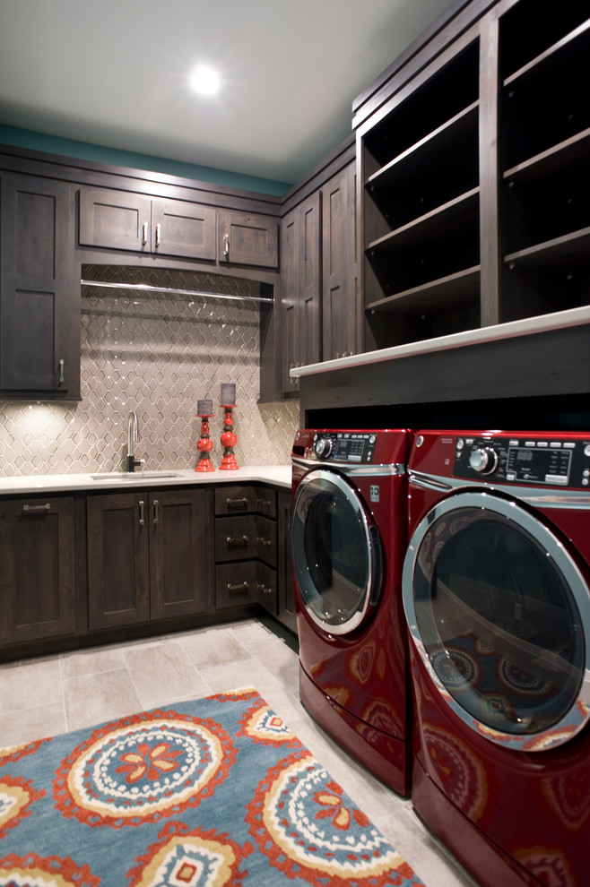 Design ideas for a small traditional l-shaped utility room in Other with a submerged sink, raised-panel cabinets, engineered stone countertops, beige walls, porcelain flooring, a side by side washer and dryer, multi-coloured floors and dark wood cabinets.