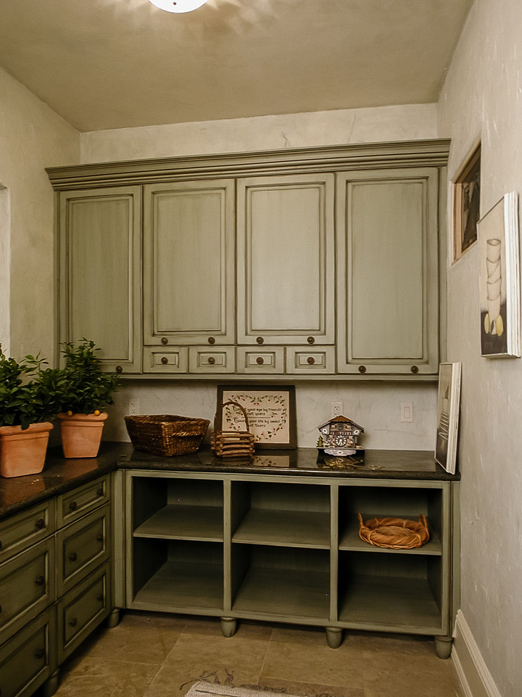 Large elegant u-shaped ceramic tile utility room photo in Salt Lake City with raised-panel cabinets, distressed cabinets, granite countertops, white walls and a side-by-side washer/dryer