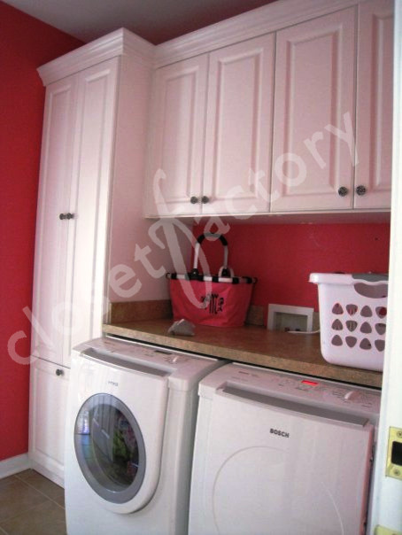 A pink and white iron sitting on top of a table photo – Laundry