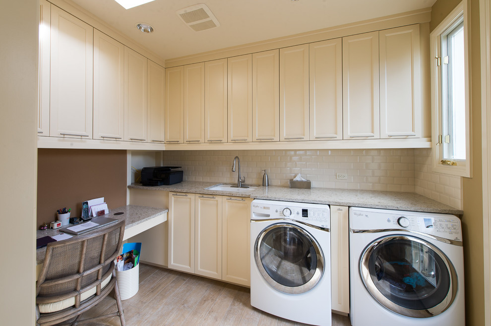This is an example of a small traditional l-shaped utility room in Other with a submerged sink, shaker cabinets, beige cabinets, granite worktops, brown walls, laminate floors, a side by side washer and dryer, beige floors and beige worktops.