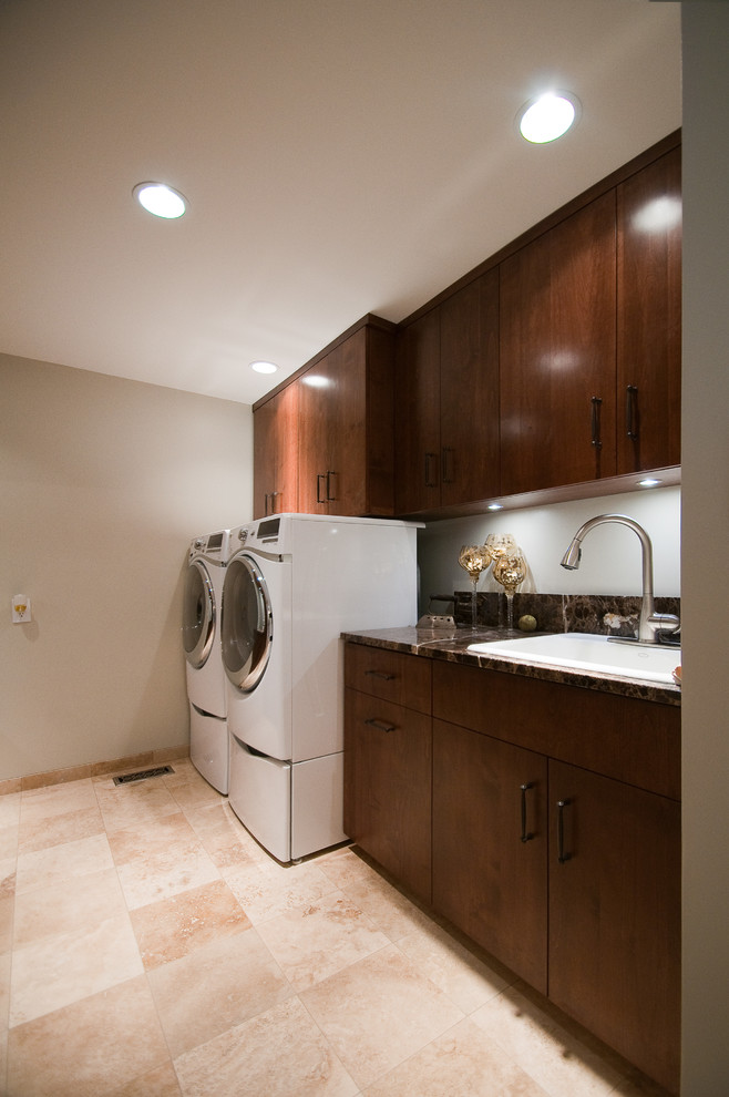 Inspiration for a mid-sized transitional single-wall ceramic tile and beige floor dedicated laundry room remodel in Other with a drop-in sink, flat-panel cabinets, brown cabinets, laminate countertops, beige walls, a side-by-side washer/dryer and brown countertops