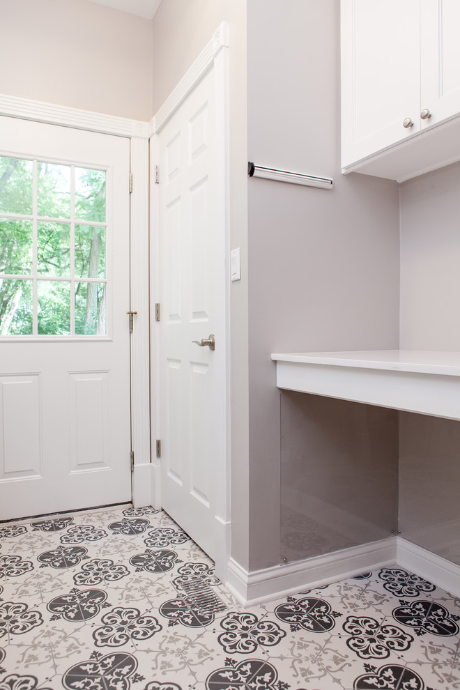 Medium sized classic galley utility room in Chicago with a single-bowl sink, shaker cabinets, white cabinets, engineered stone countertops, grey walls, porcelain flooring, a side by side washer and dryer, multi-coloured floors and white worktops.