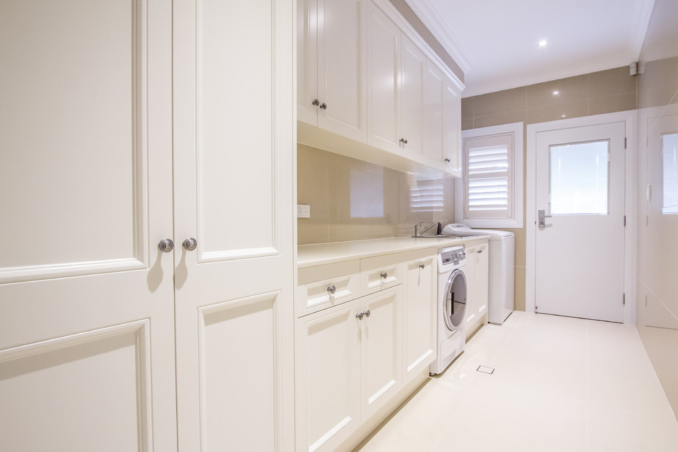 Design ideas for a large classic single-wall utility room in Sydney with shaker cabinets and white cabinets.