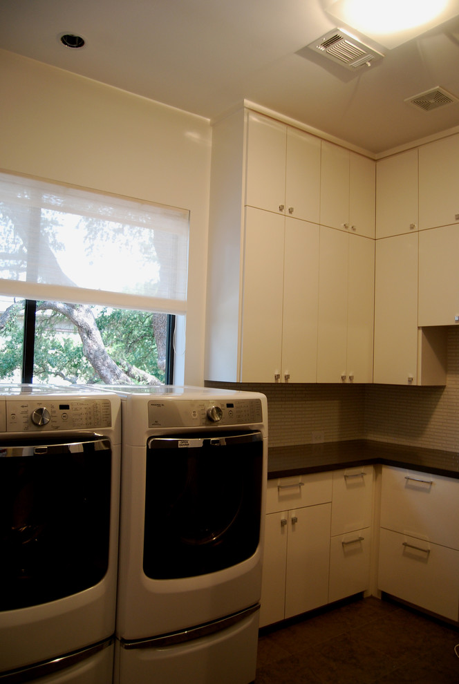 Photo of a contemporary utility room in Houston.