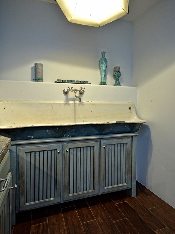 Inspiration for a rustic laundry room remodel in Austin