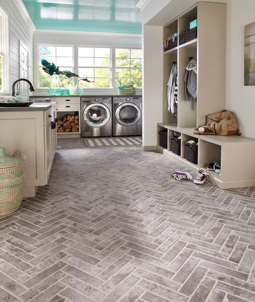 Beach style u-shaped gray floor dedicated laundry room photo in Orange County with a side-by-side washer/dryer