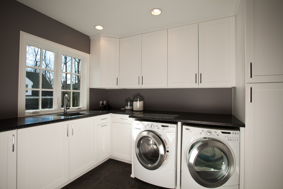 Large contemporary l-shaped separated utility room in Indianapolis with shaker cabinets, white cabinets, a side by side washer and dryer, black worktops and grey walls.