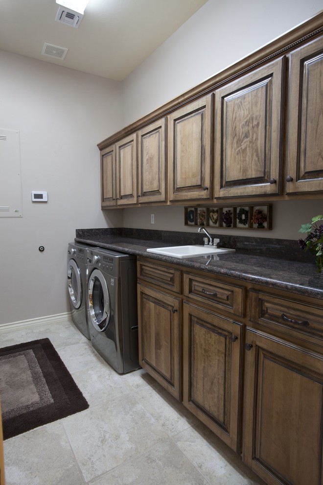 Inspiration for a southwestern laundry room remodel in Phoenix
