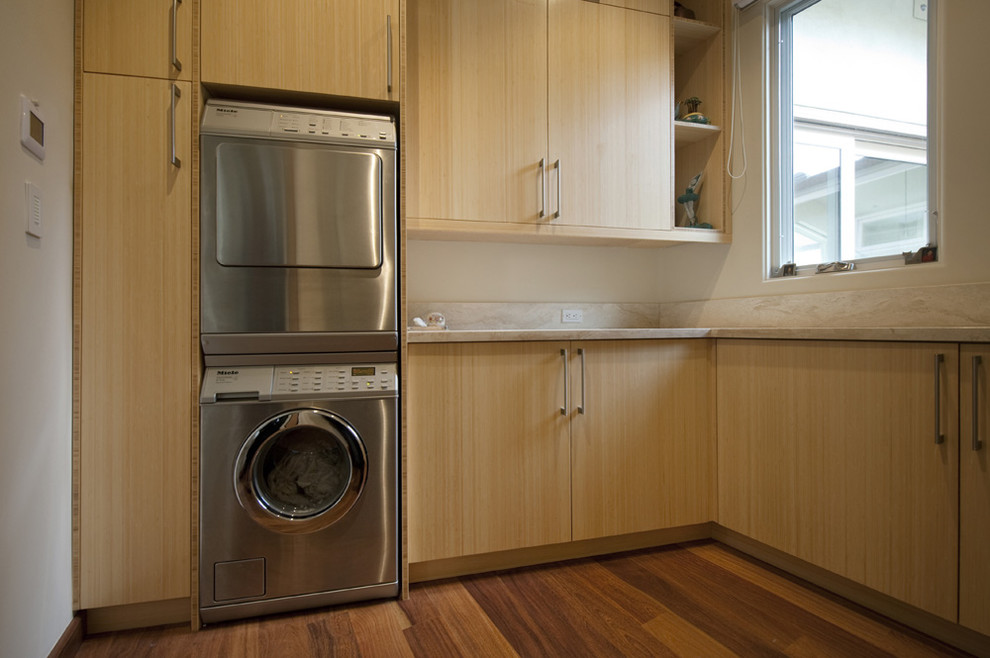 Inspiration for a contemporary laundry room remodel in Los Angeles with a stacked washer/dryer