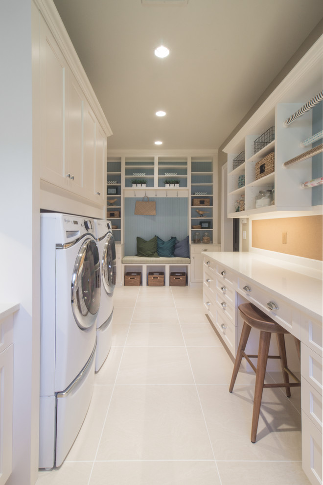 Laundry room - transitional u-shaped laundry room idea in Miami with shaker cabinets, white cabinets and quartz countertops
