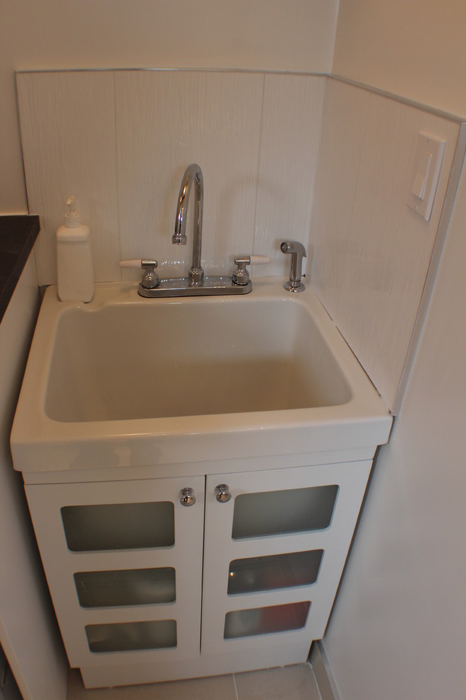 This is an example of a contemporary utility room in Edmonton.